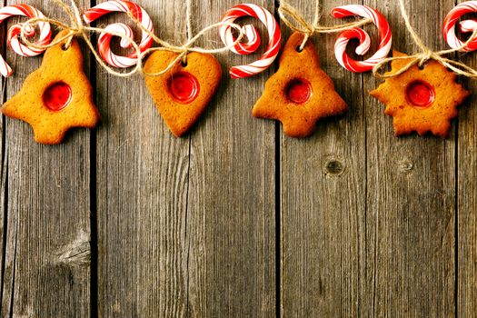 Christmas homemade gingerbread cookies over wooden table