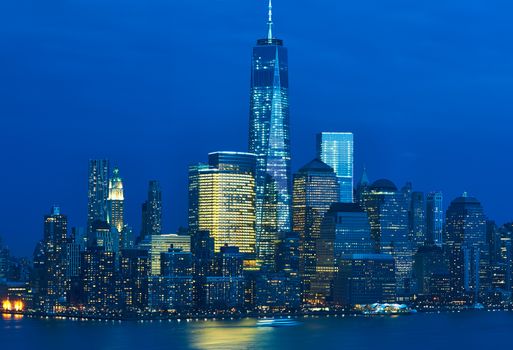 New York City Manhattan skyline with One World Trade Center Tower (AKA Freedom Tower) over Hudson River viewed from New Jersey