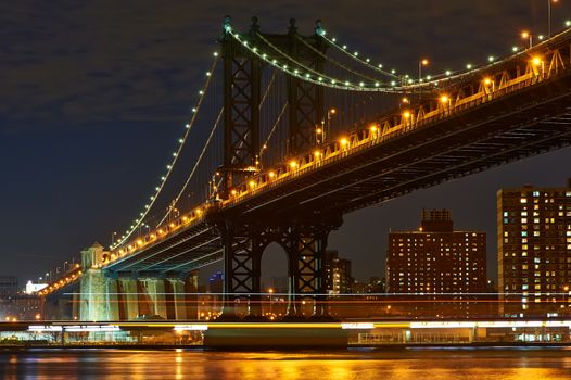 Manhattan Bridge and skyline view from Brooklyn in New York City at night