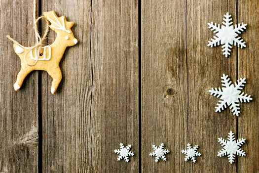 Christmas homemade gingerbread cookies over wooden table