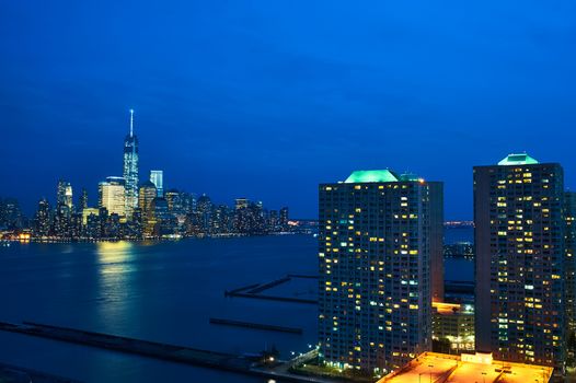 New York City Manhattan skyline with One World Trade Center Tower (AKA Freedom Tower) over Hudson River viewed from New Jersey