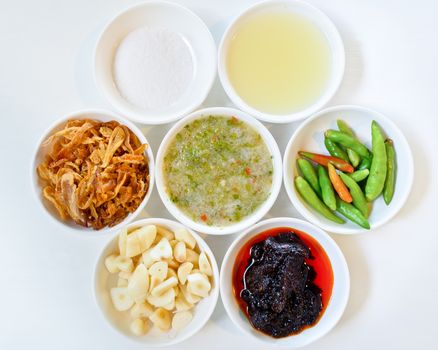 Thai food condiment in a separate small cups.