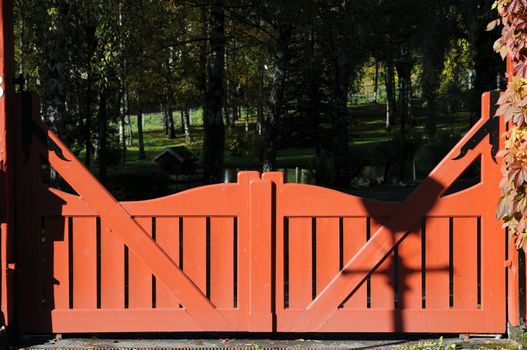 Lovely red gate to the park - peaceful place