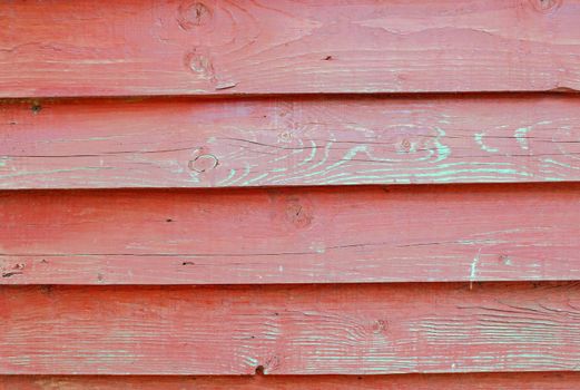 Texture of wall of -red color boards with flaky paint