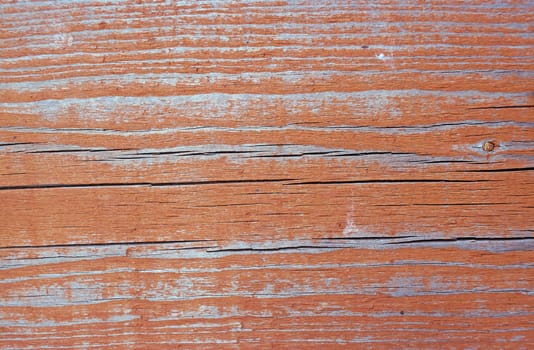 Texture of wall of rusty-red color boards with flaky paint                               