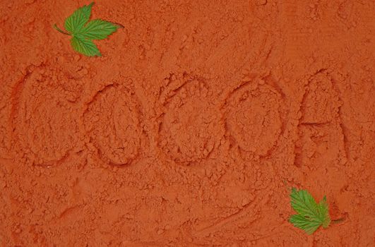 Background of spillage of cocoa powder with the word "Cocoa"                               