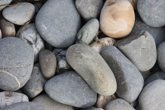 stones and rocks on a sandy beach background