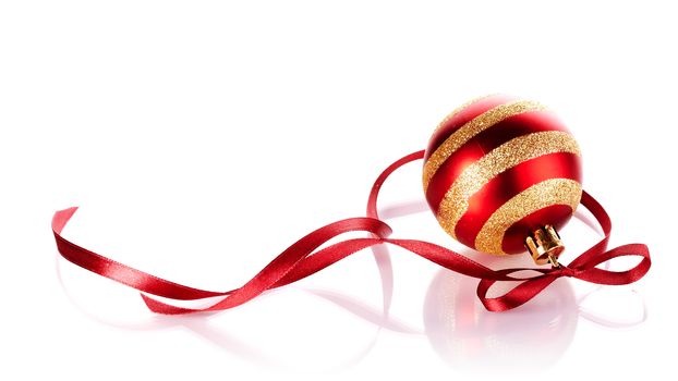 Striped New Year's ball with a red tape. New Year's ball. Christmas ball. Christmas tree decorations. Christmas jewelry.