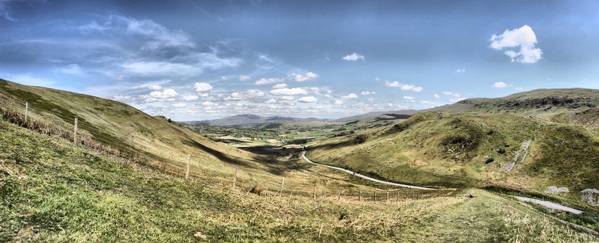 Stunning welsh mountains under a cloudy blue sky