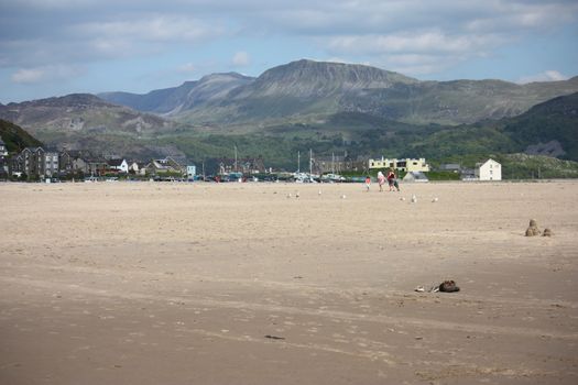 cadair idris mountain range looking down on barmouth beach