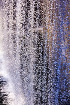 911 Memorial Pool Blue Waterfall Droplets Patterns Abstract New York NY.  Pool is in the foundation of one of the Two World Trade Center Buildings.  Water falls into hole of the foundation.  