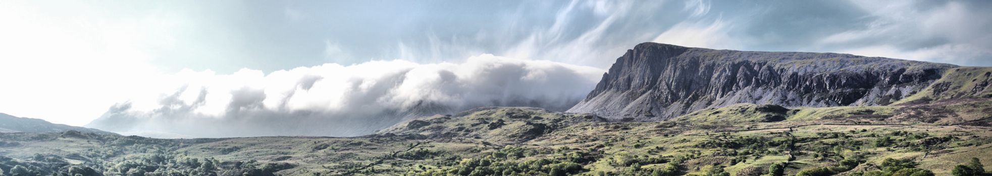 Stunning welsh mountains under a cloudy blue sky