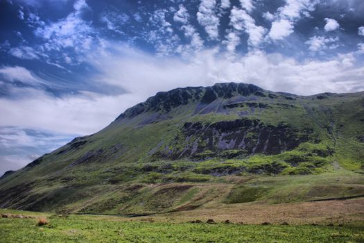 Stunning welsh mountains under a cloudy blue sky