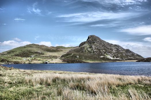 Stunning welsh mountains under a cloudy blue sky