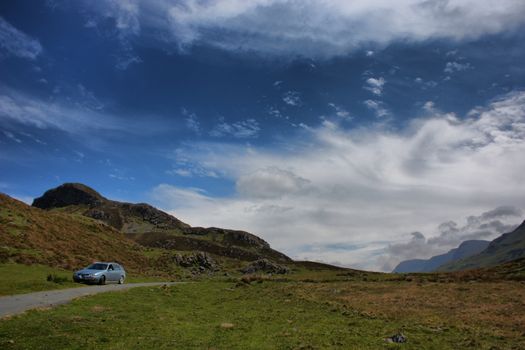 Stunning welsh mountains under a cloudy blue sky