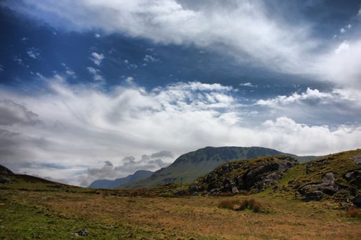 Stunning welsh mountains under a cloudy blue sky