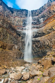 Hengifoss is the second highest waterfall on Iceland. It is located on the East on the island. Perhaps the most special thing about the waterfall are multicolored layers in the basalt rock behind the waterfall