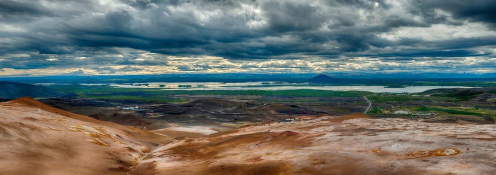 View from the top of the Namafjall, the vivid volcanic mountain, at the lake Myvatn, Iceland. HDR panorama