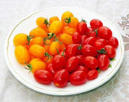 Cherry tomatoes red and yellow on a plate