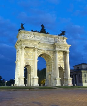 Frontal facade view of Arco della Pace (Arch Of Peace) at dusk, Milan, Lombardy, Italy, Europe.