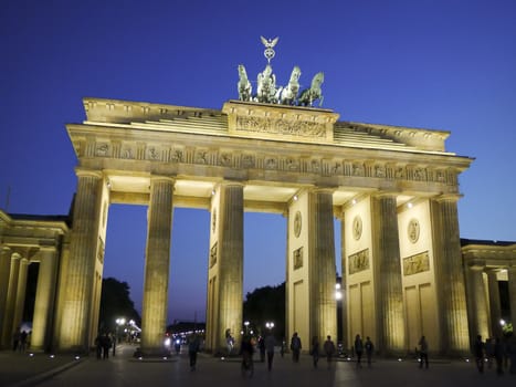 Frontal view of Brandenburg Gate at dusk in a beautiful summer day, Berlin, Germany, Europe.