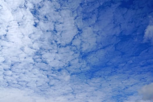 Blue sky with white clouds as background