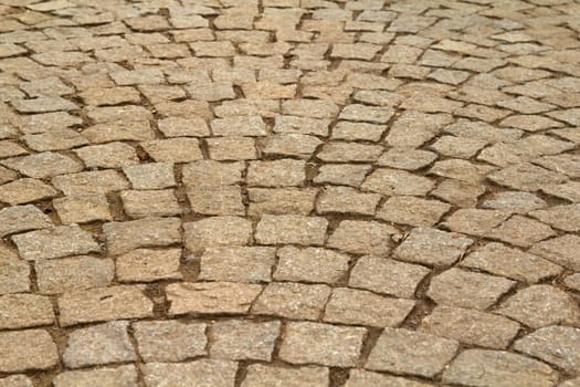 Photo shows details of old stony walking cubes.