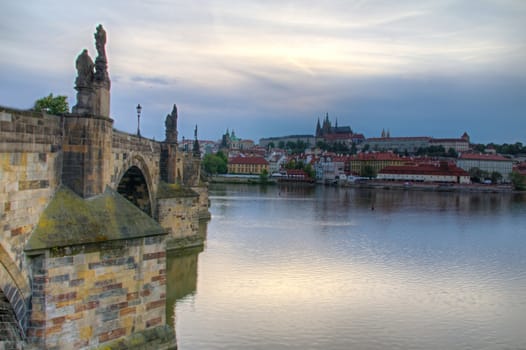 Photo shows general view of Prague castle and Vltava river.