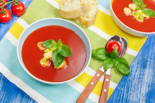 Tomato soup with basil in a bowl