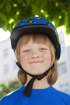 Portrait of a Happy Boy in Bicycle Helmet Smiling