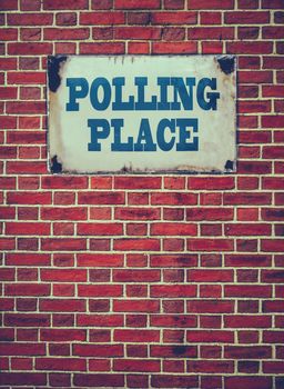 Retro Filtered Sign For An Election Polling Place Or Station On A Red Brick Wall