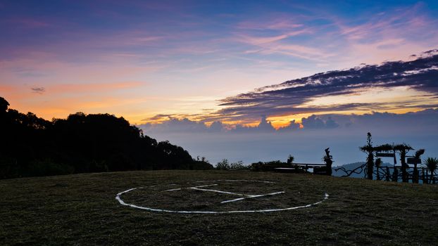 Helipad on top of the Doi Ang Khang mountain at sunrise in Chiang Mai province of Thailand