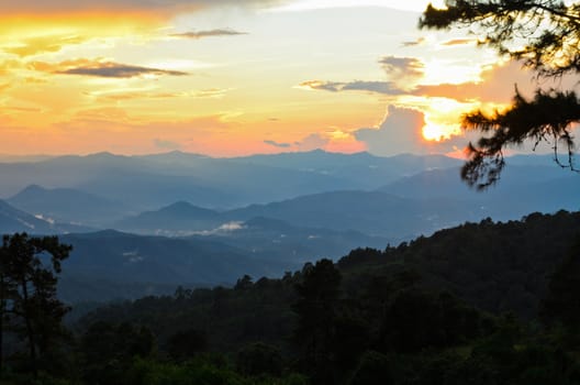Sunset over high mountain range at viewpoint in Huai Nam Dang national park in Chiang Mai and Mae Hong Son of Thailand