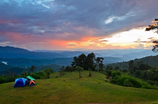 Sunset over hills at campsite on the high mountain in Huai Nam Dang national park, Chiang Mai and Mae Hong Son province of Thailand