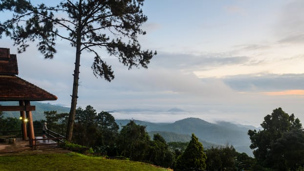 Tourists are standing views of high mountains and haze on viewpoint at Huai Nam Dang national park in Chiang Mai and Mae Hong Son, Thailand