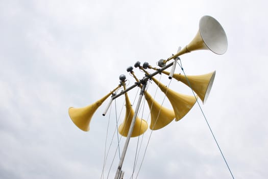 large yellow loudspeaker system