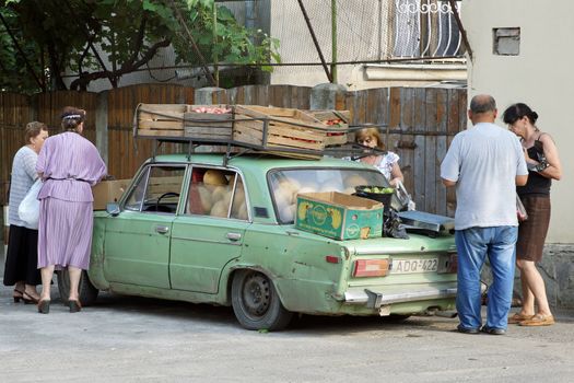 MZCHETA, GEORGIA - JULY 02, 2014: Man selling melons on a fruit stand on July 02, 2014 in Mzcheta, Georgia, Europe