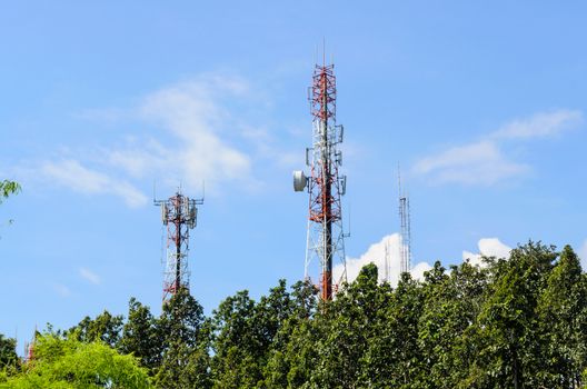 Multiplicity communications tower on blue sky background