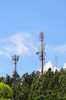 Multiplicity communications tower on blue sky background