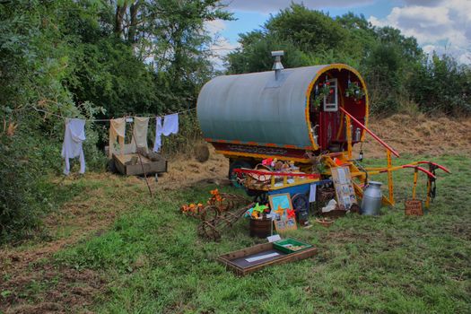 an old gipsy caravan set up in a camp