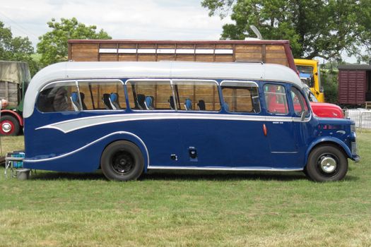 an old fashioned blue luxury coach