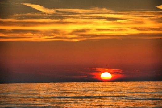 Beautiful sunset over a quiet calm ocean