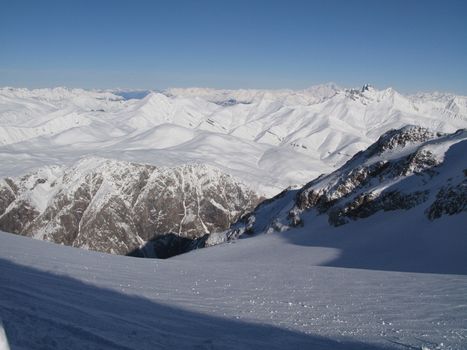 snow covered mountain peaks in the alps