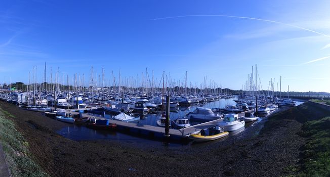 sailing and power boats moored in lymington marina