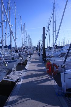 sailing and power boats moored in lymington marina