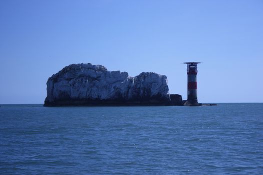 The red and white striped lighthouse at the needles in the solent