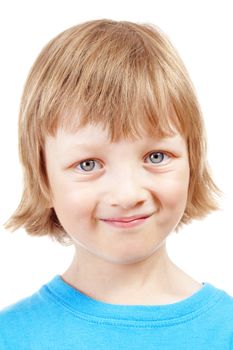 portrait of a boy with blond hair in blue top smiling - isolated on white