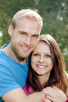 portrait of a happy young couple smiling.