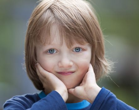 Portrait of a Beatiful Boy with Blond Hair