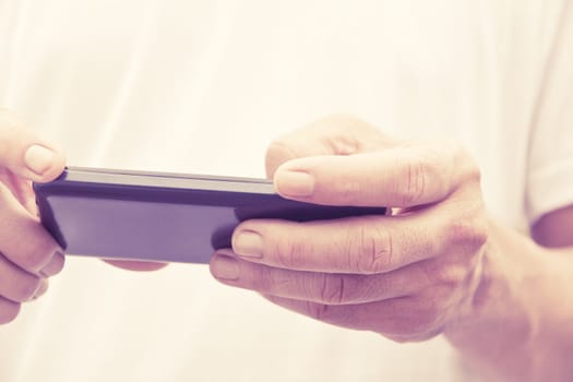 Close up of man checking his phone
